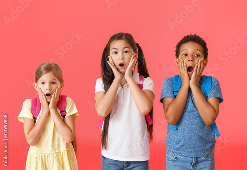 Surprised little schoolchil...