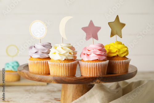 Tasty cupcakes with stylish...
