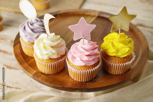 Tasty cupcakes with stylish...