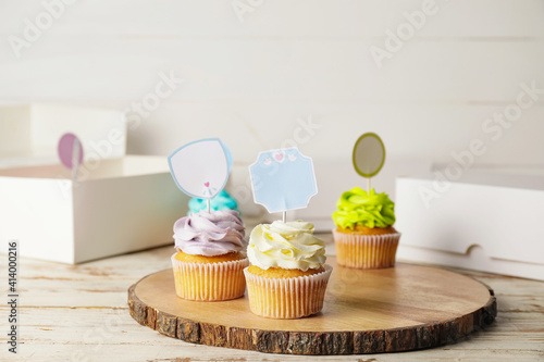 Tasty cupcakes with stylish...
