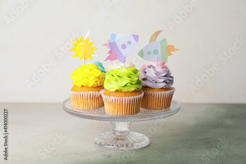 Tasty cupcakes with stylish...