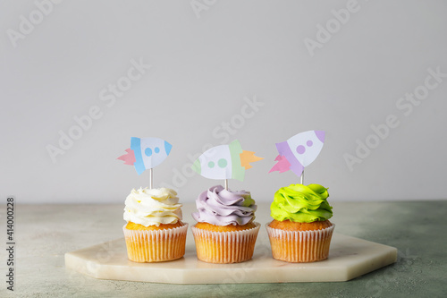 Tasty cupcakes with stylish...