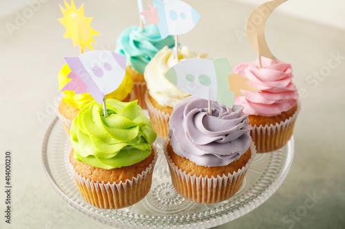 Tasty cupcakes with stylish...
