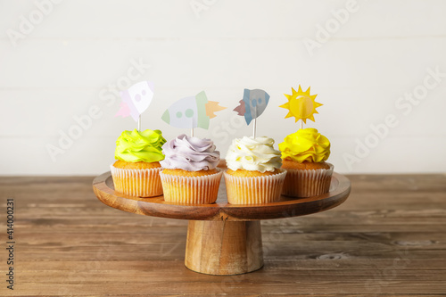 Tasty cupcakes with stylish...