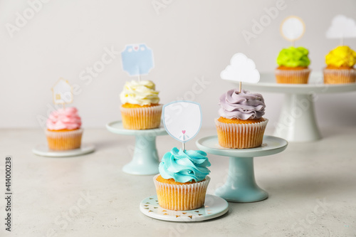 Tasty cupcakes with stylish...