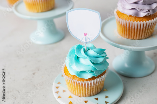 Tasty cupcakes with stylish...