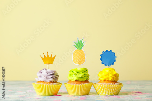 Tasty cupcakes with stylish...