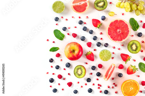 Fresh summer fruit design, a flat lay on a white background with a place for text, vibrant food pattern, overhead shot