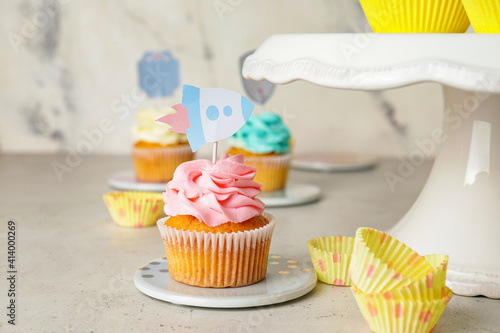 Tasty cupcakes with stylish...