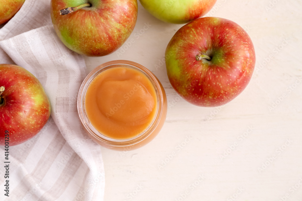 Jar with sweet apple jam on light background Jar with sweet apple jam on light background