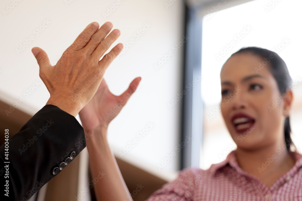 Fototapeta premium Close-up of a black woman and two colleagues holding hands Symbol of sincerity, empathy Reliable person, trusted friend, true friendship concept