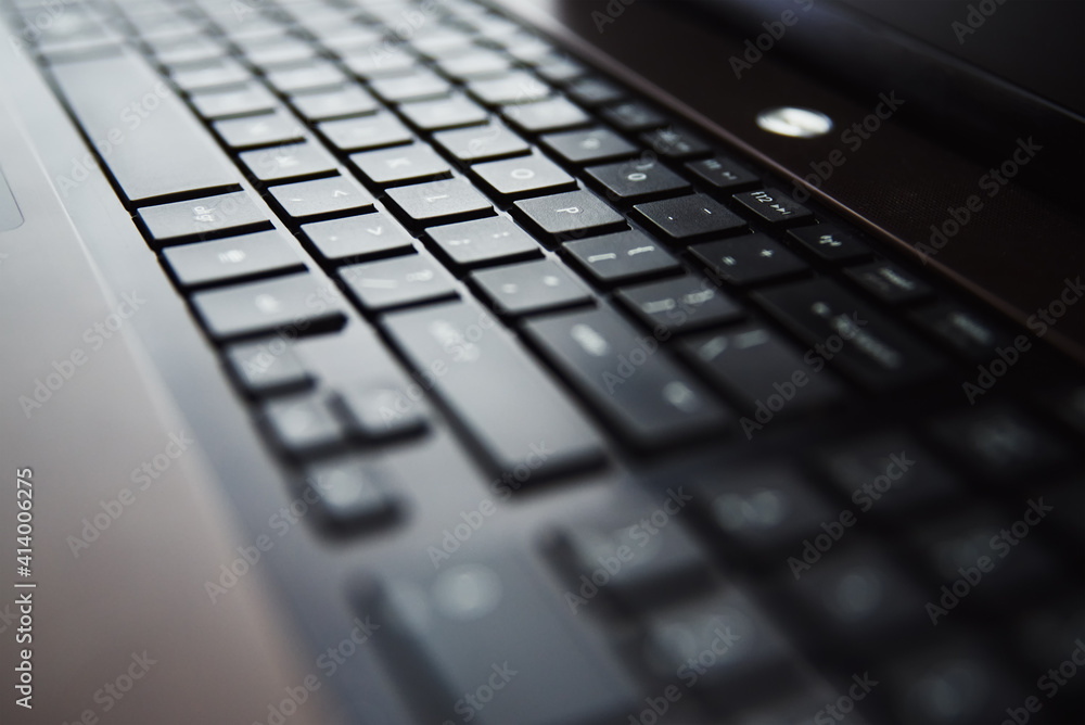 Laptop keyboard, close-up. Online working and education concept