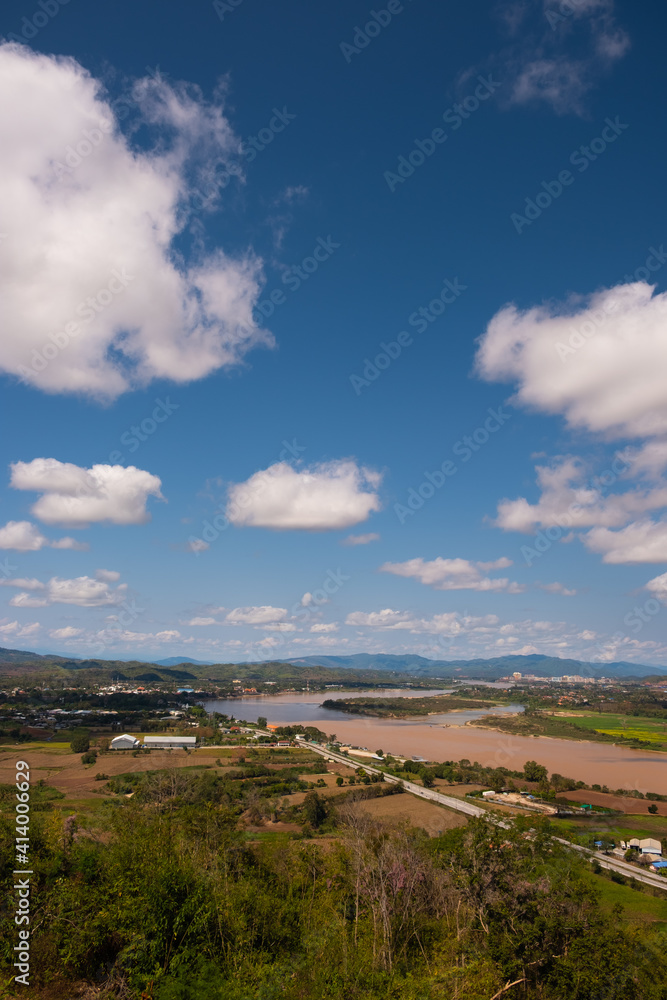 The sky has clouds and the Mekong River.sky and cloud.white clouds.Village near the river.Border river.River border Thailand and Laos. Chiang Saen,Chiang Rai.
