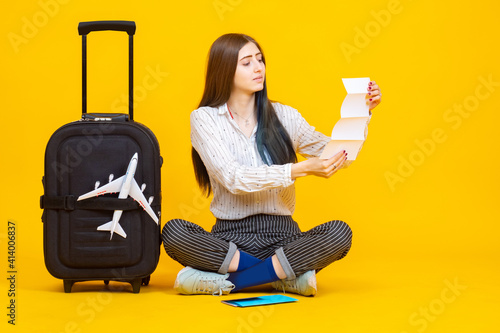 The girl sits next to the s...