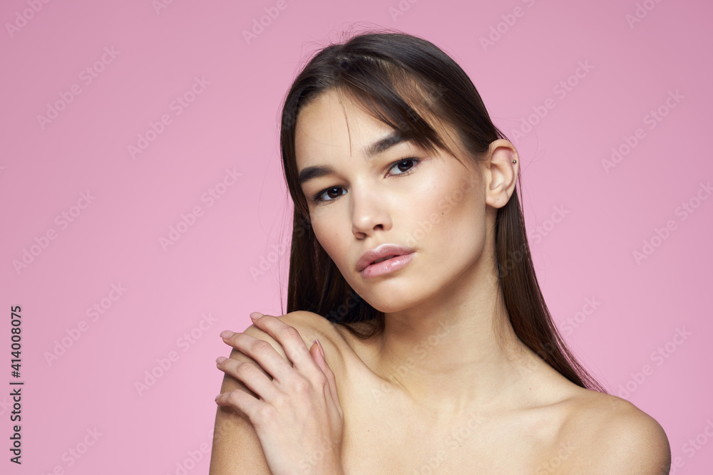 brunette bare shoulders clear skin body care pink background brunette bare shoulders clear skin body care pink background