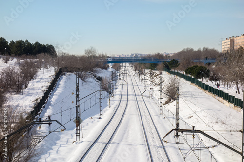 Snowy train tracks in Coslada on a cold winter morning.