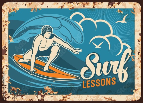 Surf lessons rusty metal plate with man surfing board on seascape background with gulls. Vector vintage rust tin sign for surfer classes educational service, retro poster, ferruginous promotional card