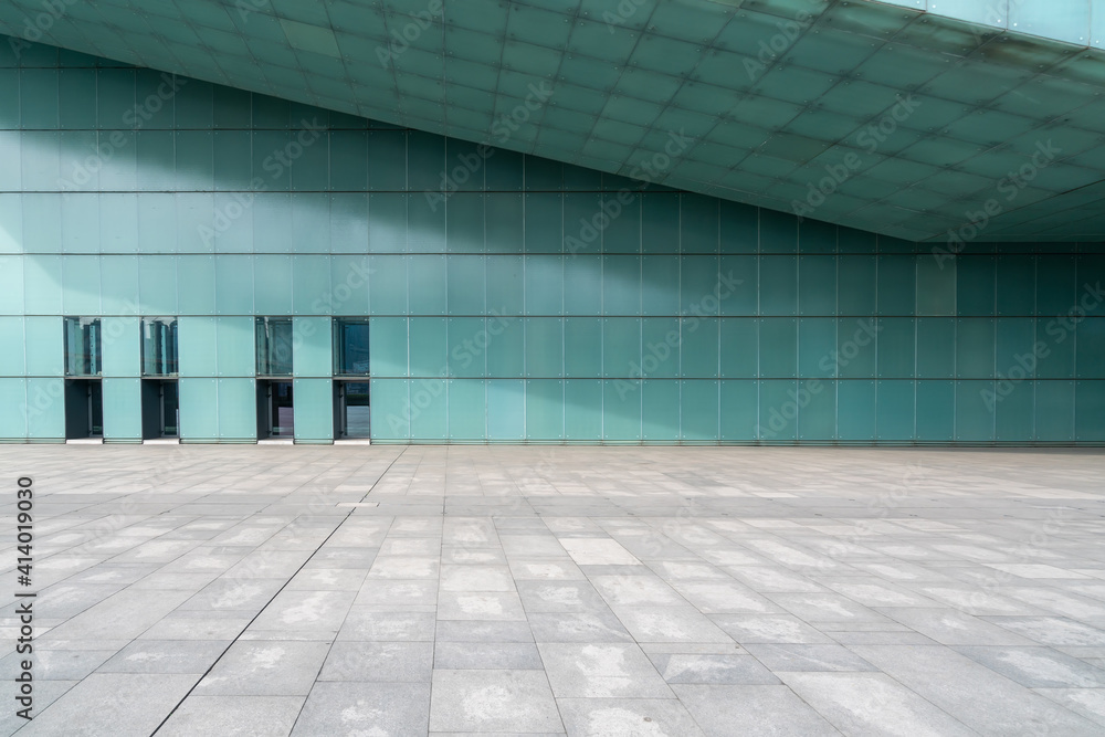The empty floor of the square and the exterior walls of modern buildings