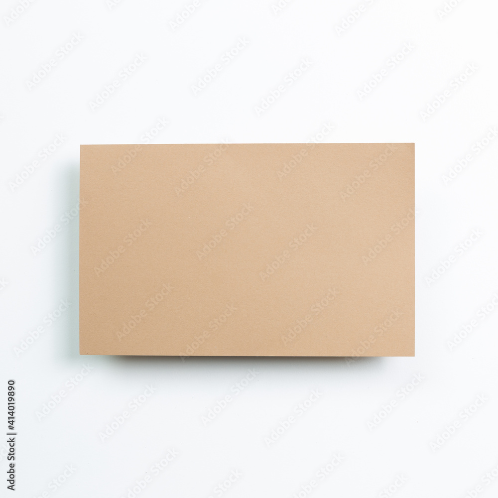 Blank brown memo pad on white background. top view, copy space Blank brown memo pad on white background. top view, copy space