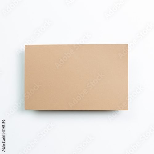 Blank brown memo pad on white background. top view, copy space
