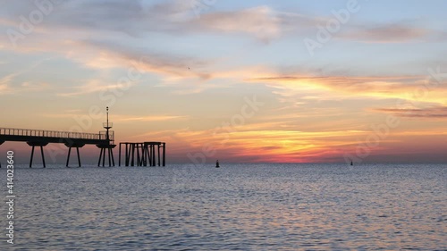 Wallpaper Mural Early morning a few minutes before sunrise. Dawn on the sea with pontoon. Blue sky is painted in shades of pink and orange Torontodigital.ca