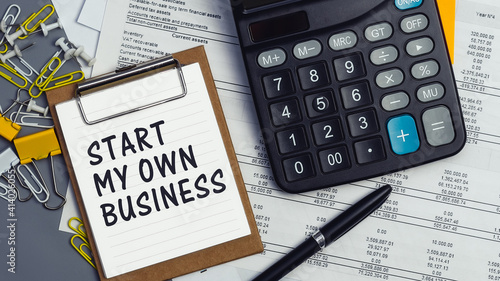 Wallpaper Mural The words Start my own Business written on a white notebook Torontodigital.ca