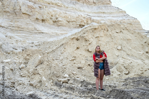 young fashion woman posign in sand mountains