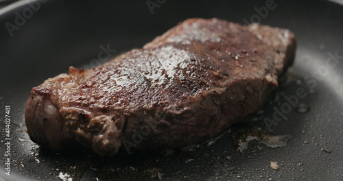 new york steak on nonstick pan