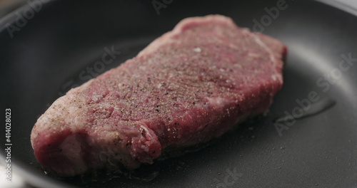 new york steak on nonstick pan