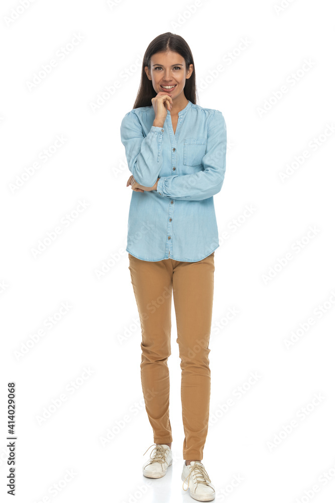 attractive casual woman touching her chin, folding arms attractive casual woman touching her chin, folding arms