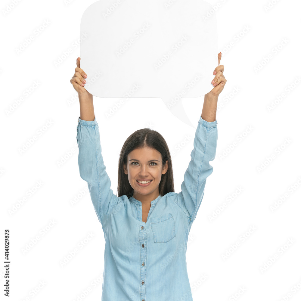 casual woman holding a speech bubble overhead casual woman holding a speech bubble overhead
