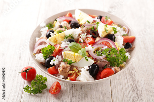 mixed rice salad with egg, tomato, olive