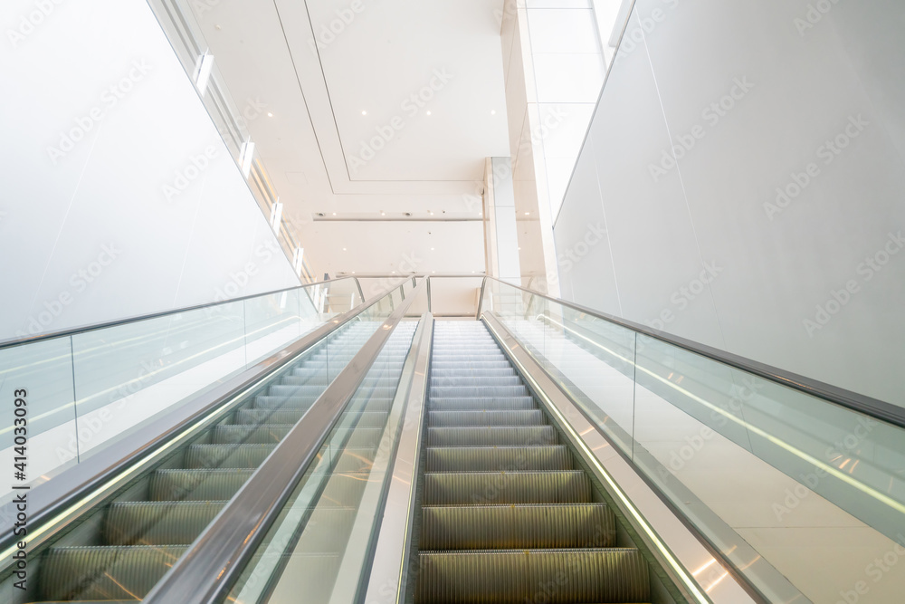 The escalator is in the mall The escalator is in the mall