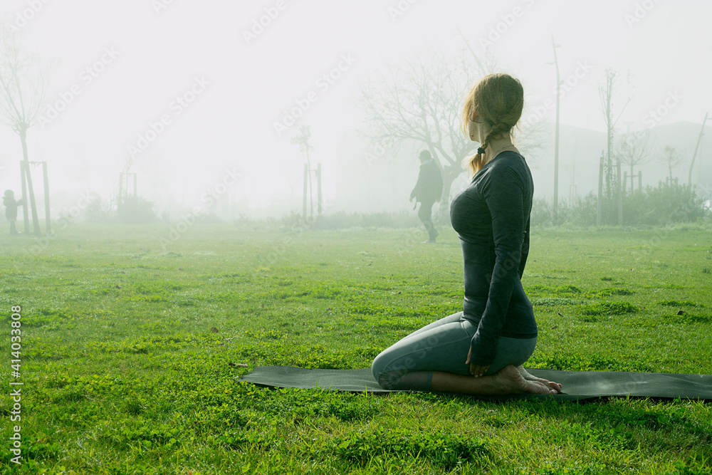 Young woman doing yoga in the park Young woman doing yoga in the park