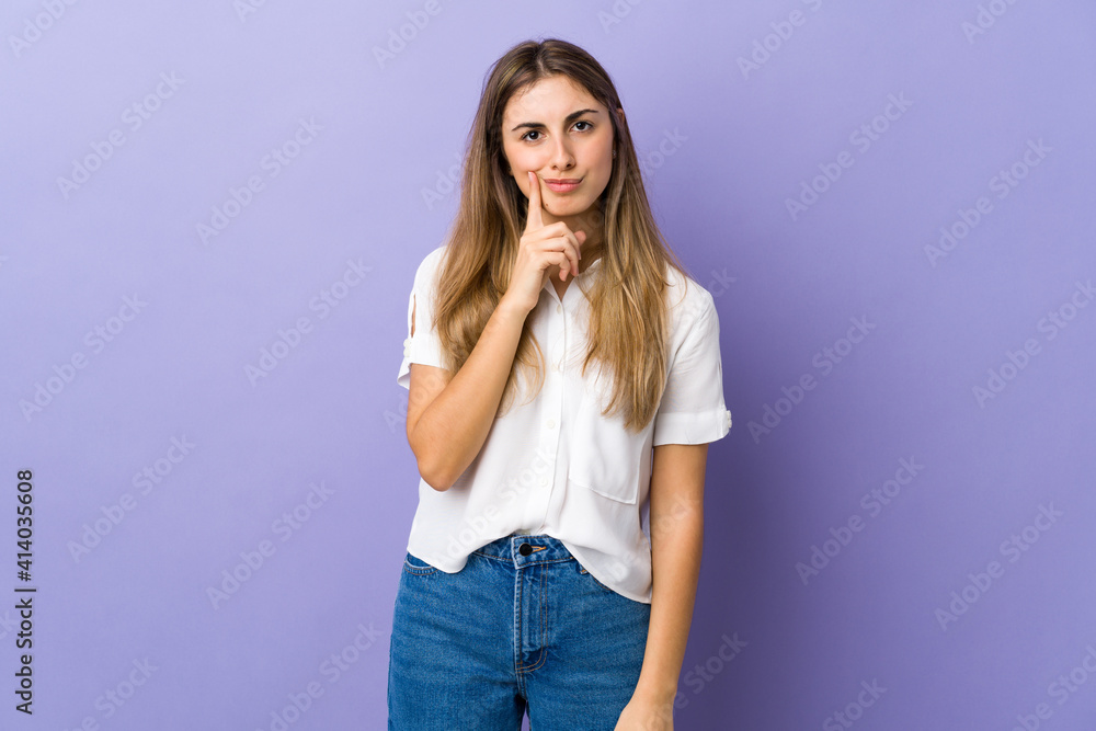 Young woman over isolated purple background and thinking Young woman over isolated purple background and thinking