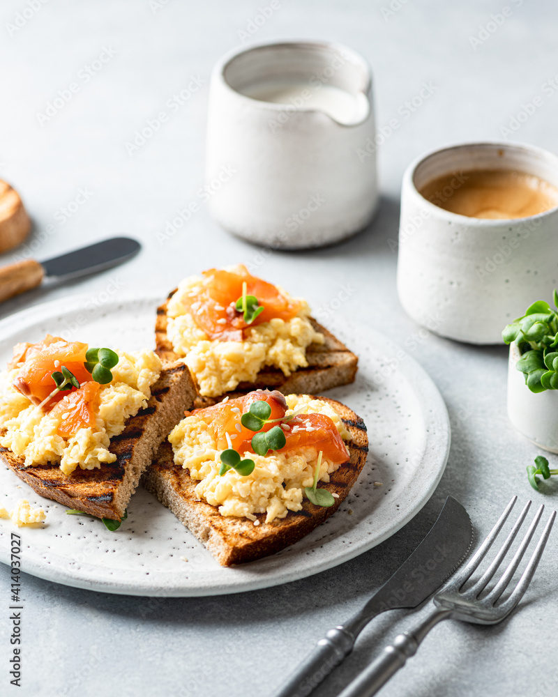 scrambled eggs toast with salmon and coffee , selective focus scrambled eggs toast with salmon and coffee , selective focus
