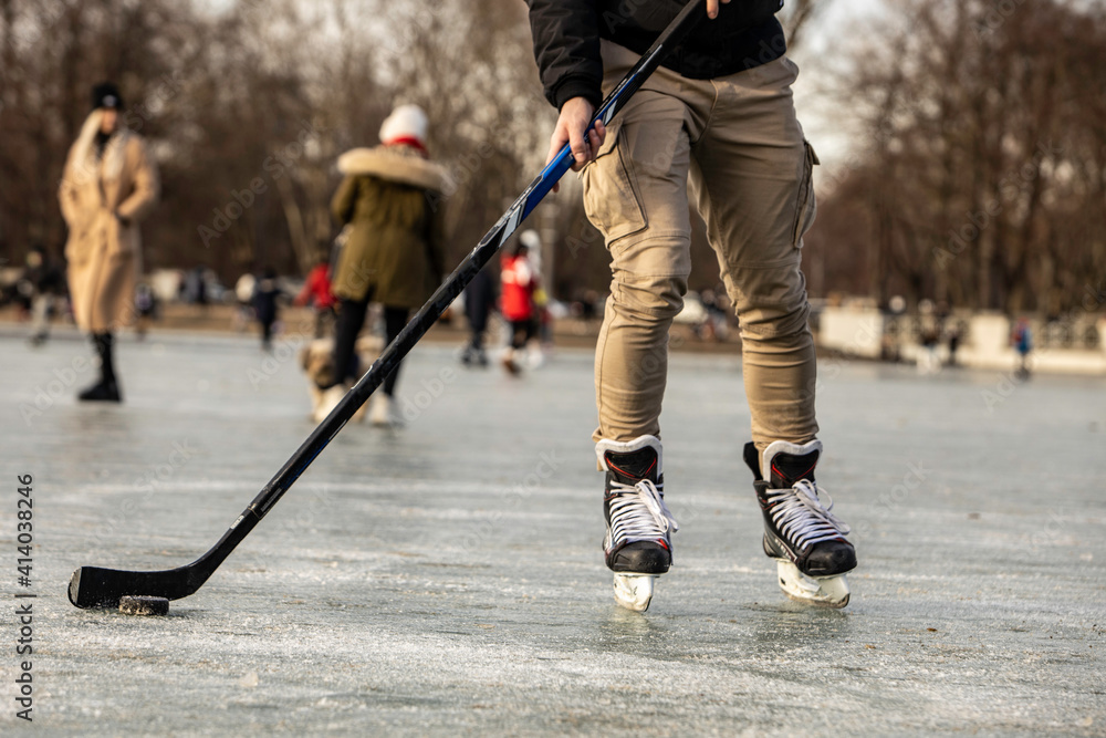 Man ice hockey in public park from Cologne, Germany Man ice hockey in public park from Cologne, Germany