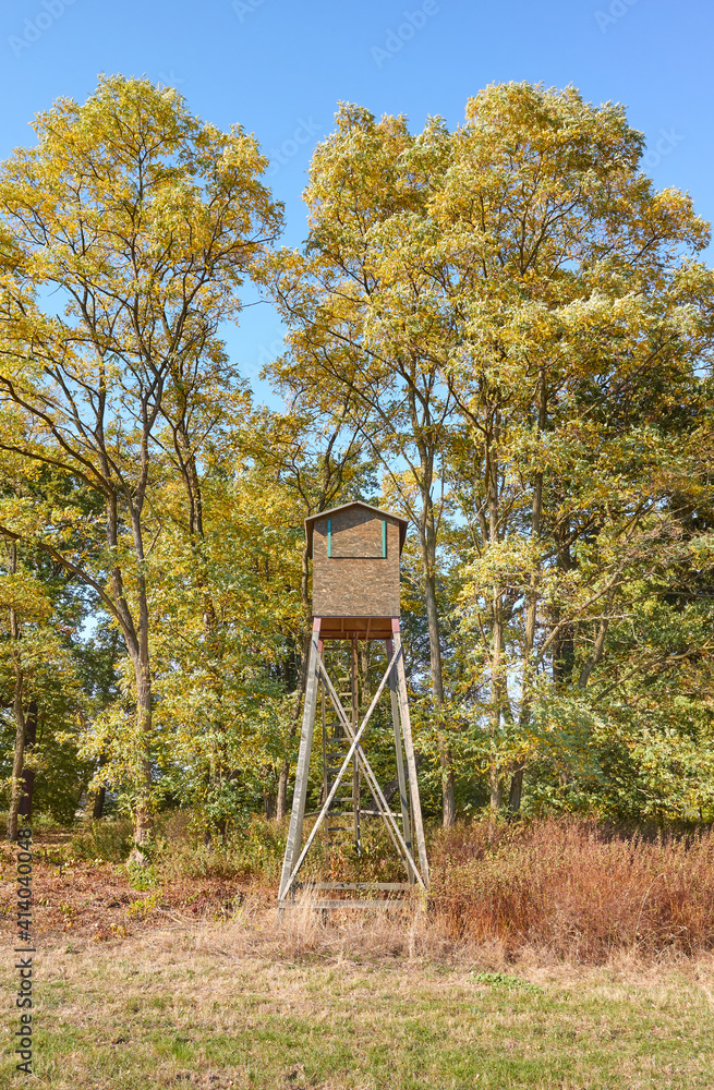 Picture of a wooden hunting tower in autumn.