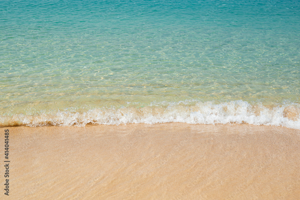 Sea with soft waves and sandy beach. Travel, vacation concept.
