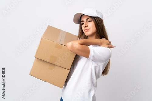 Young delivery woman over isolated white background suffering from pain in shoulder for having made an effort