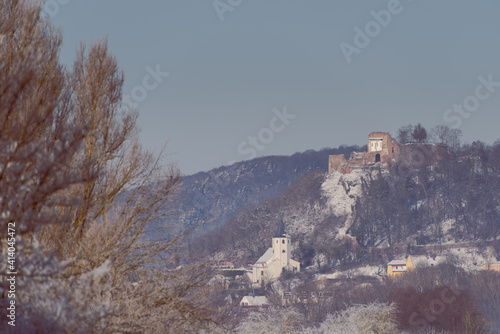 Parish Church and castle ruin of Donaustauf near Regensburg in Bavaria on cold winter day with snow and rime