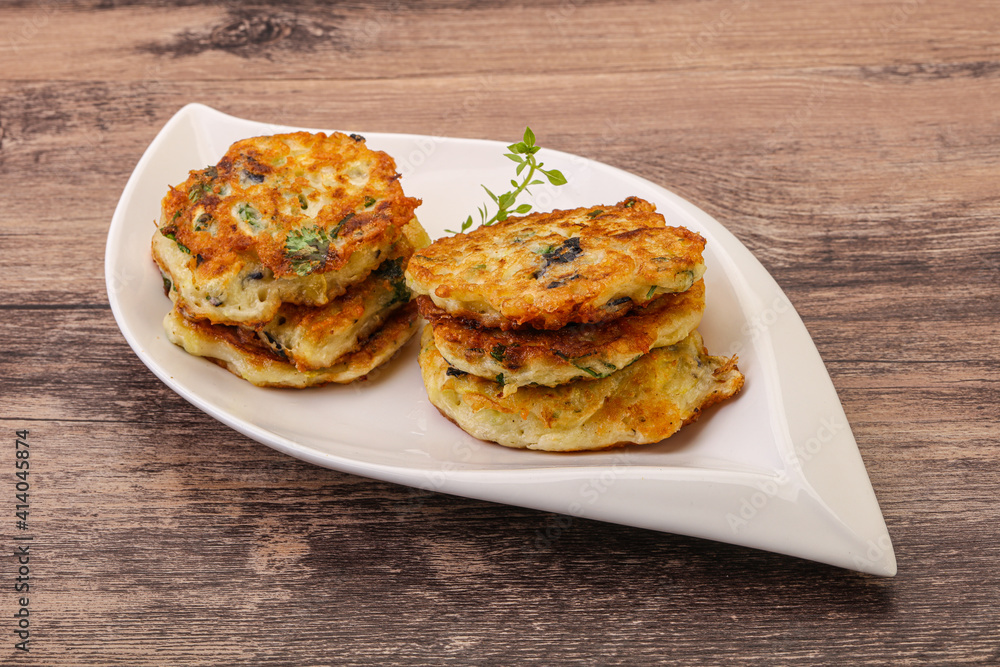 Zucchini pancakes with herbs and spices Zucchini pancakes with herbs and spices