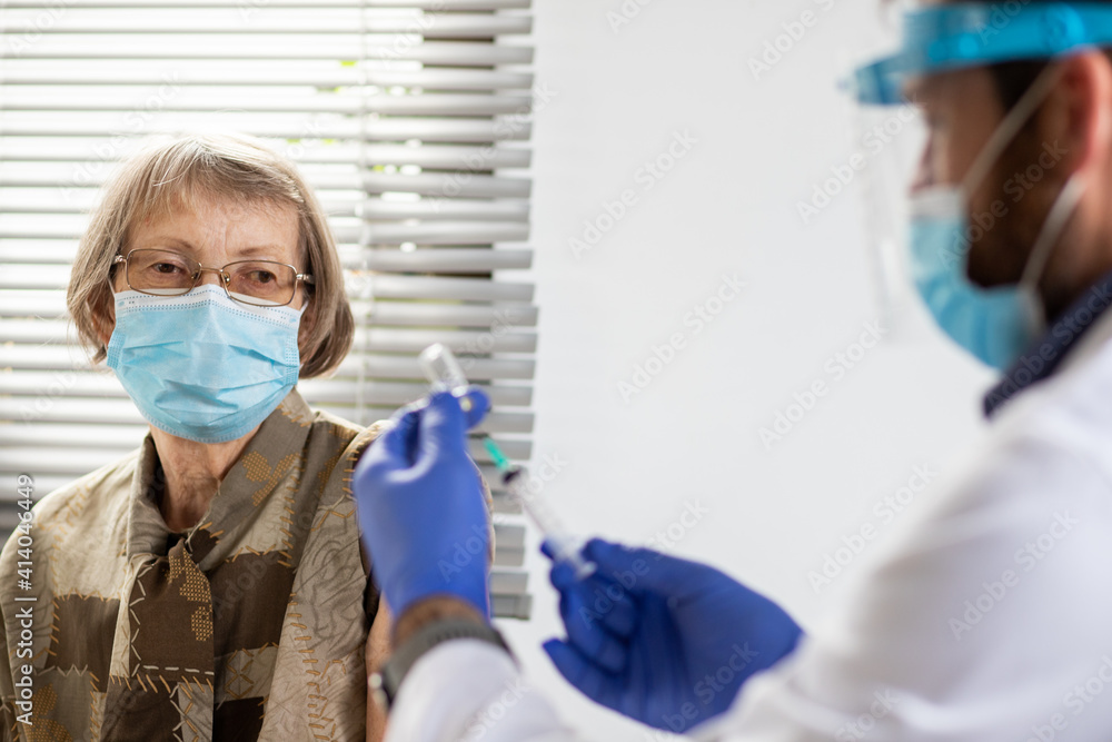 elderly woman getting coronavirus vaccine elderly woman getting coronavirus vaccine