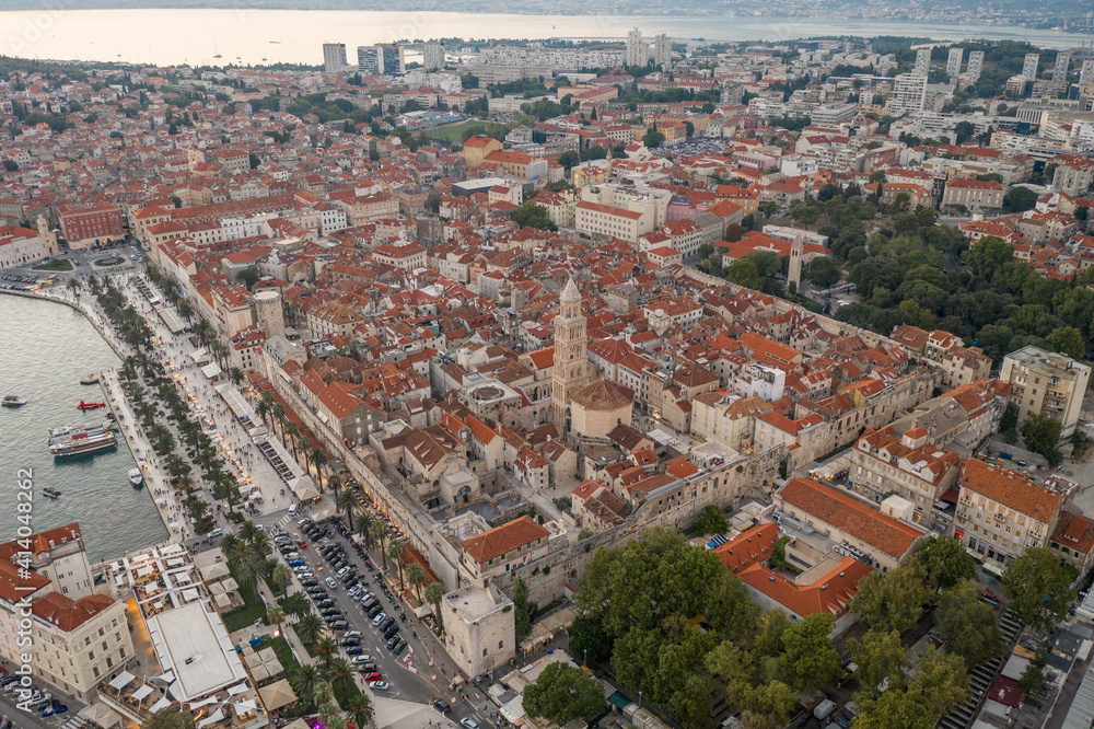 Aerial drone shot of Diocletian Palace by port riva in Split old town in Croatia in sunset