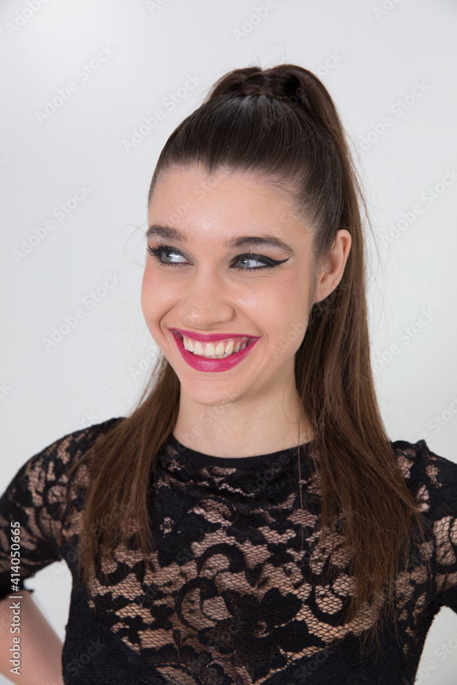 Sexy brunette in black dress on white background.
Sexy brunette in black dress on white background.