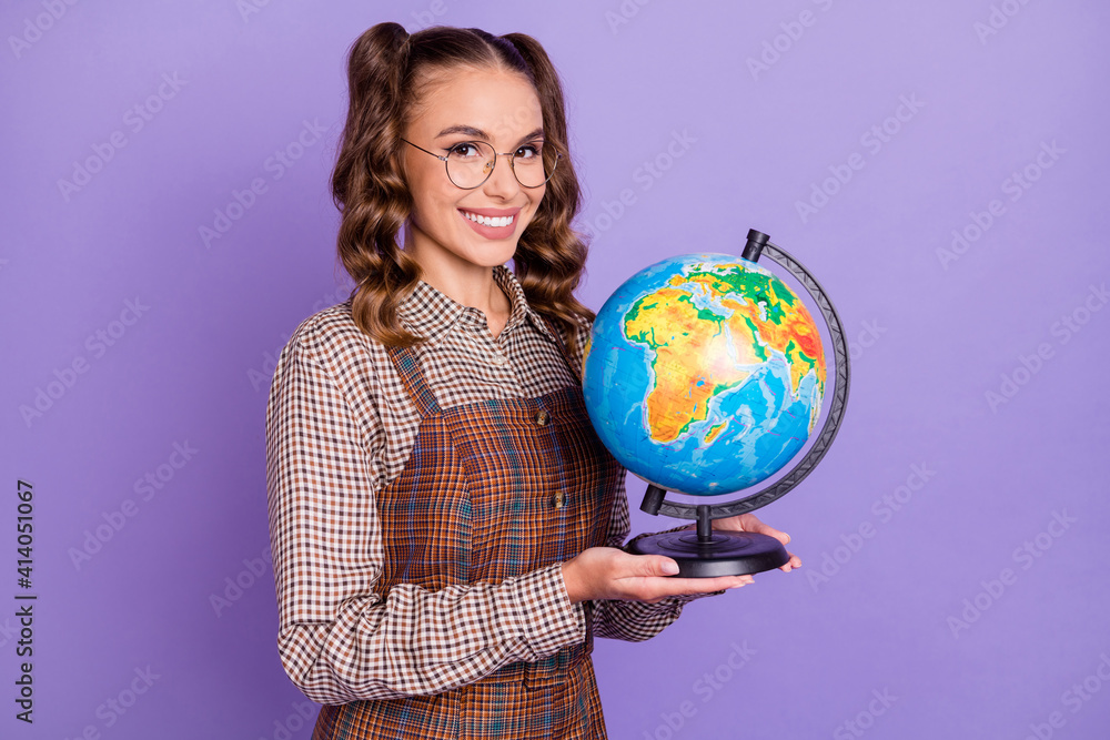 Photo of half turned cheerful person hands hold globe beaming smile isolated on magenta color background Photo of half turned cheerful person hands hold globe beaming smile isolated on magenta color background