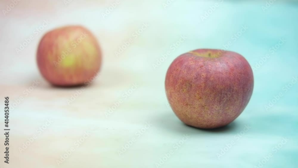 Panning shot fresh red apple and apple rolling into. Panning shot fresh red apple and apple rolling into.