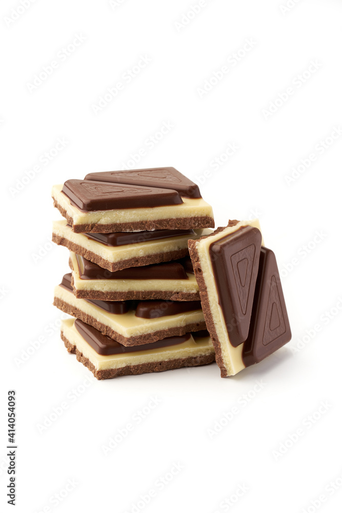 Stack of pieces of milk chocolate isolated on white background Stack of pieces of milk chocolate isolated on white background