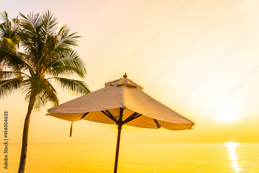 Umbrella and deck chair around beach sea ocean with coconut palm tree