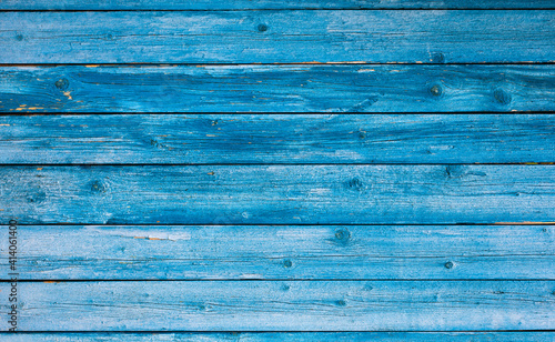 Weathered blue wooden background texture. Shabby blue painted wood.
